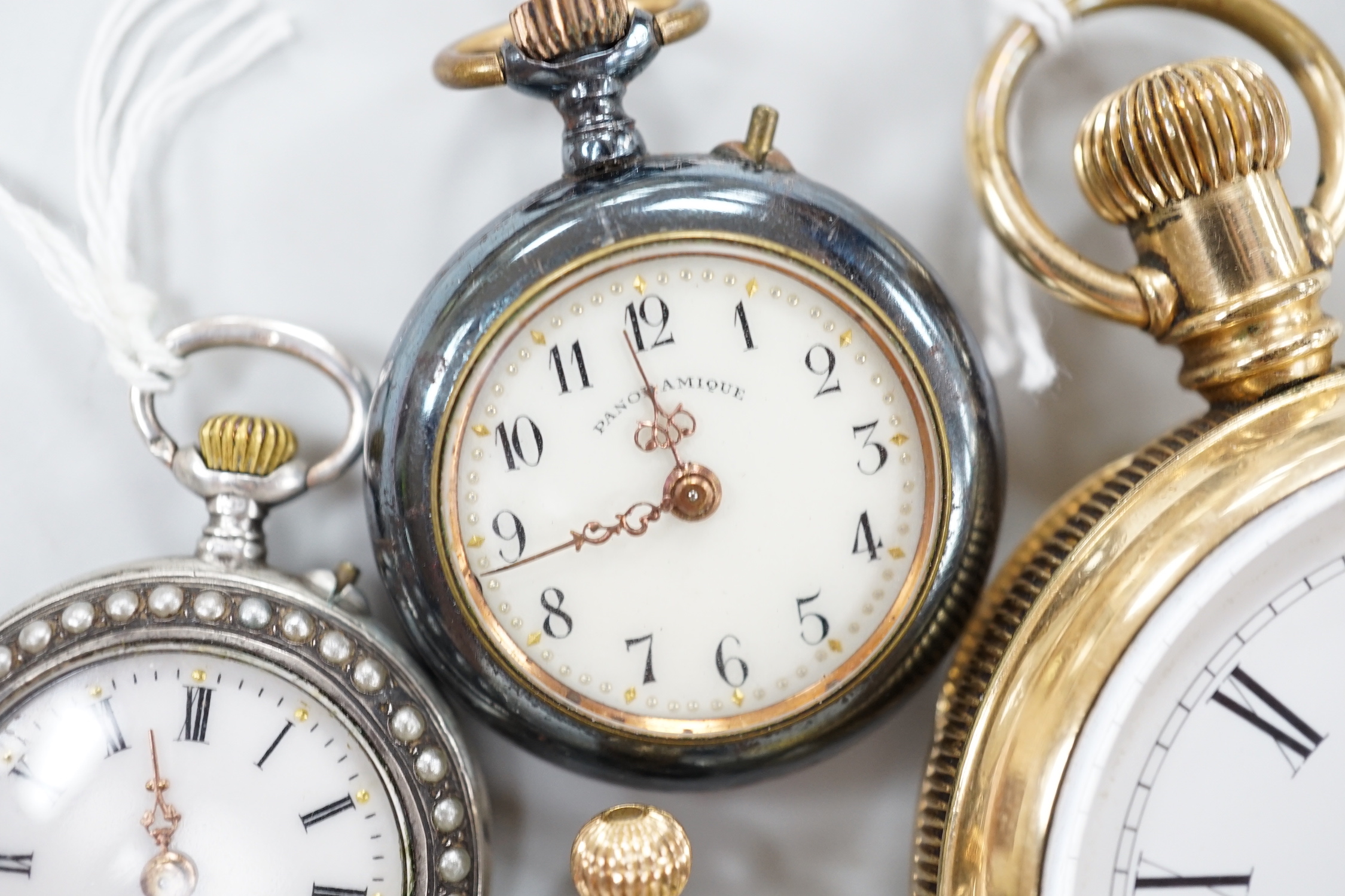 A gold plated open face pocket watch, a silver wrist watch, three fob watches including Art Nouveau 935 and enamelled and a globe watch.